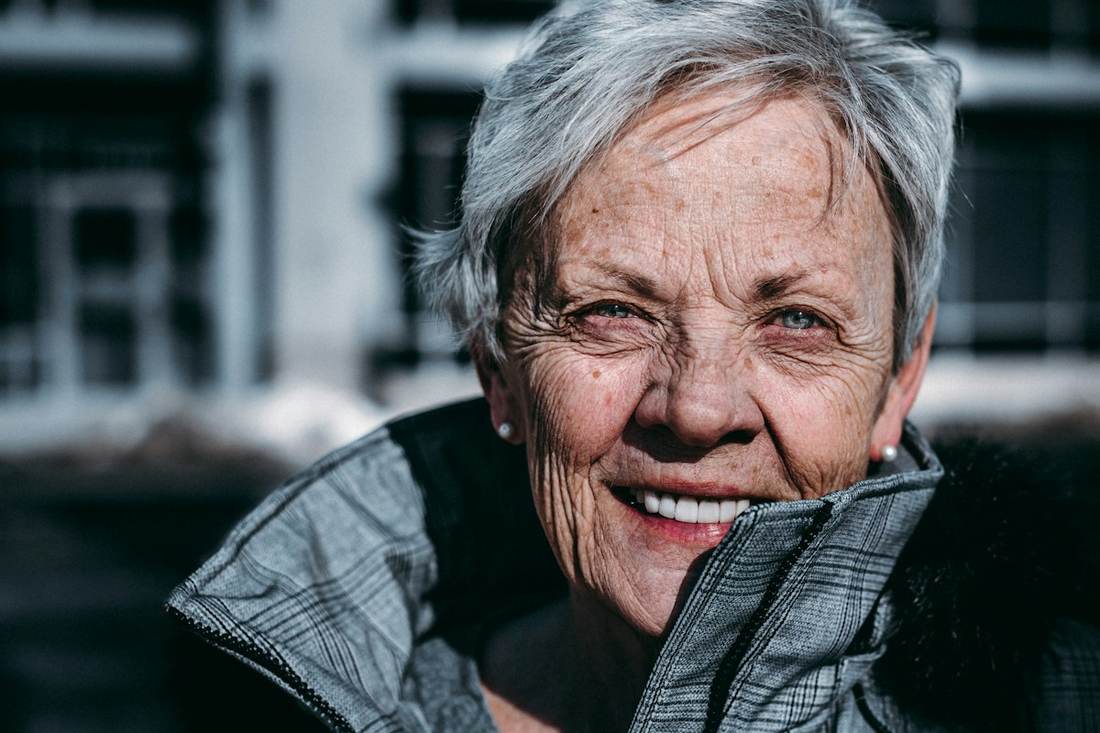 Smiling older woman outdoors